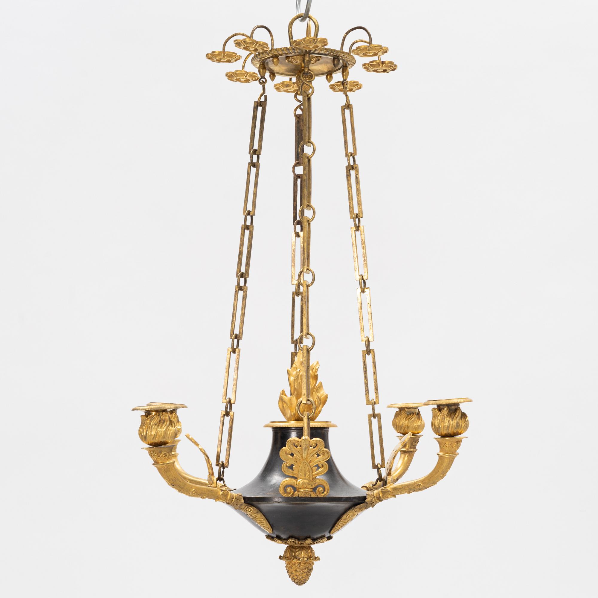 A French Empire ormolu and patinated bronze four-branch chandelier, early 19th century.