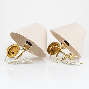 A pair of brass wall lamps, EWÅ, later part of the 20th century.