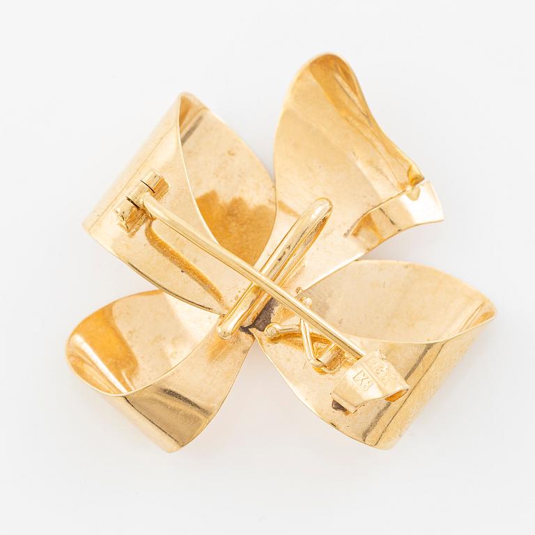 Brooch, 18K gold in the form of a bowknot.