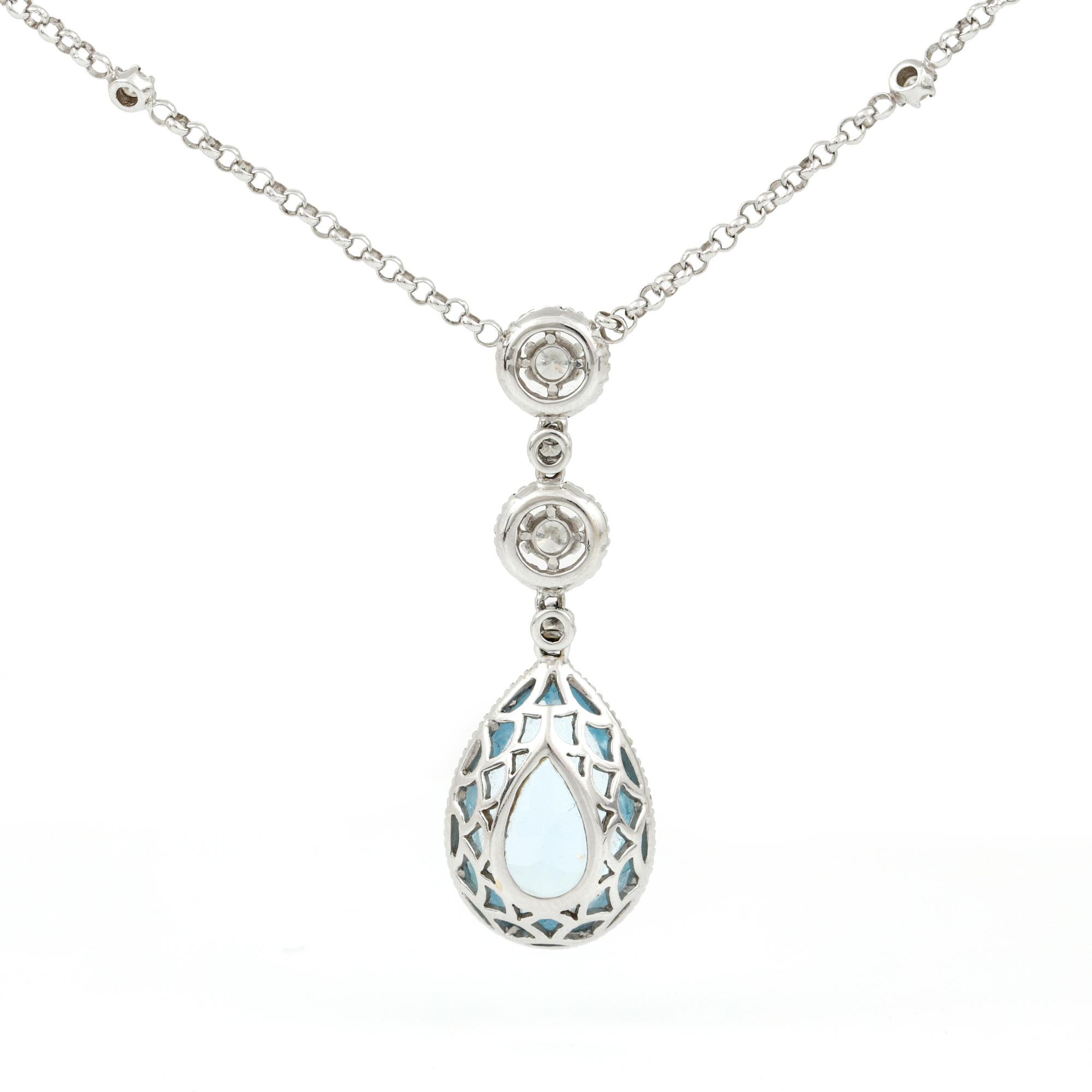 HÄNGSMYCKE, droppslipad topaz med briljantslipade diamanter, tot. ca 0.75 ct.