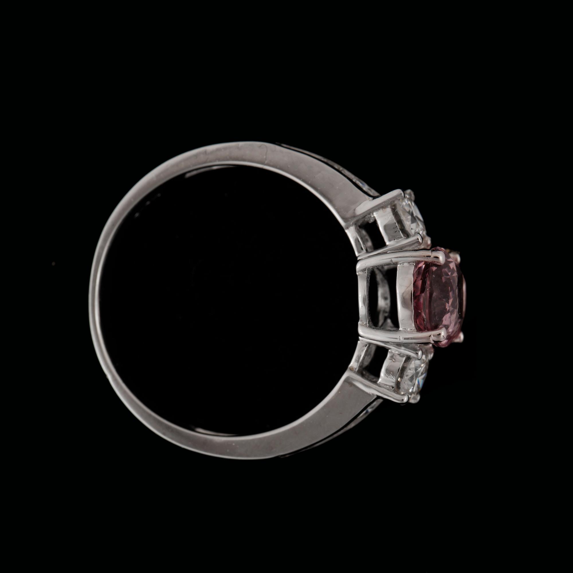 A pink sapphire, circa 1.55 cts, and diamond, total circa 0.7 ct, ring.