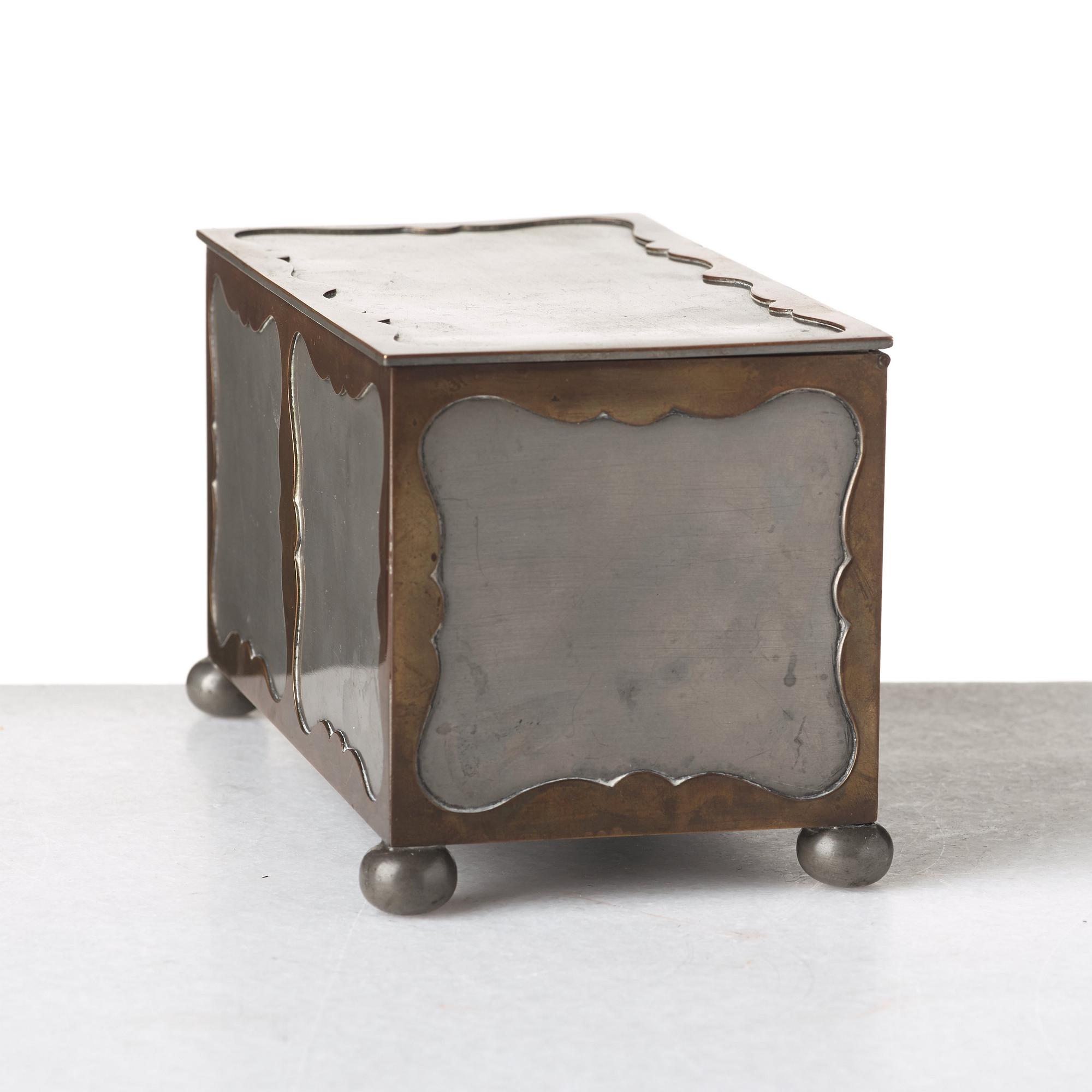 Firma Svenskt Tenn, a pewter and brass box, Stockholm 1930, model A 854.