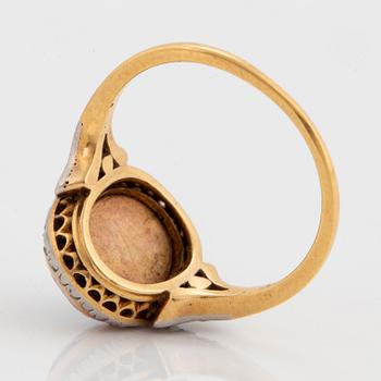 A miniature portrait ring.