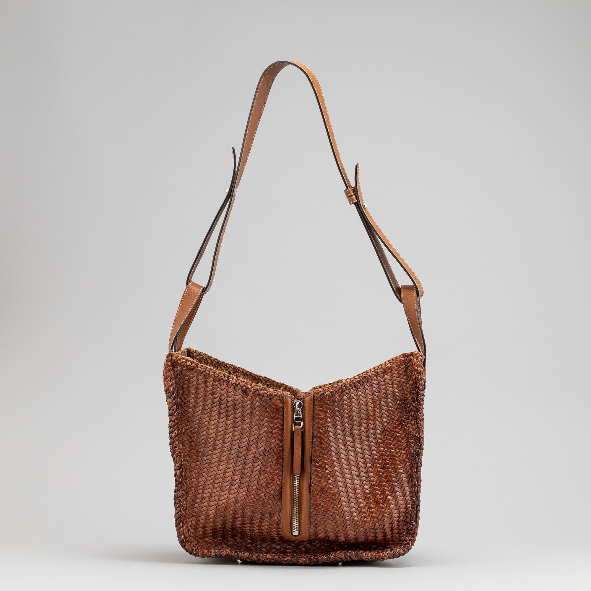 Loewe, a brown woven leather handbag.