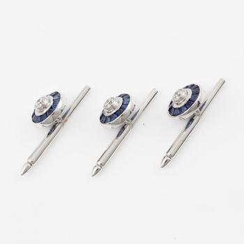 Three shirt buttons in 18K and 14K white gold set with faceted sapphires and round brilliant-cut diamonds.