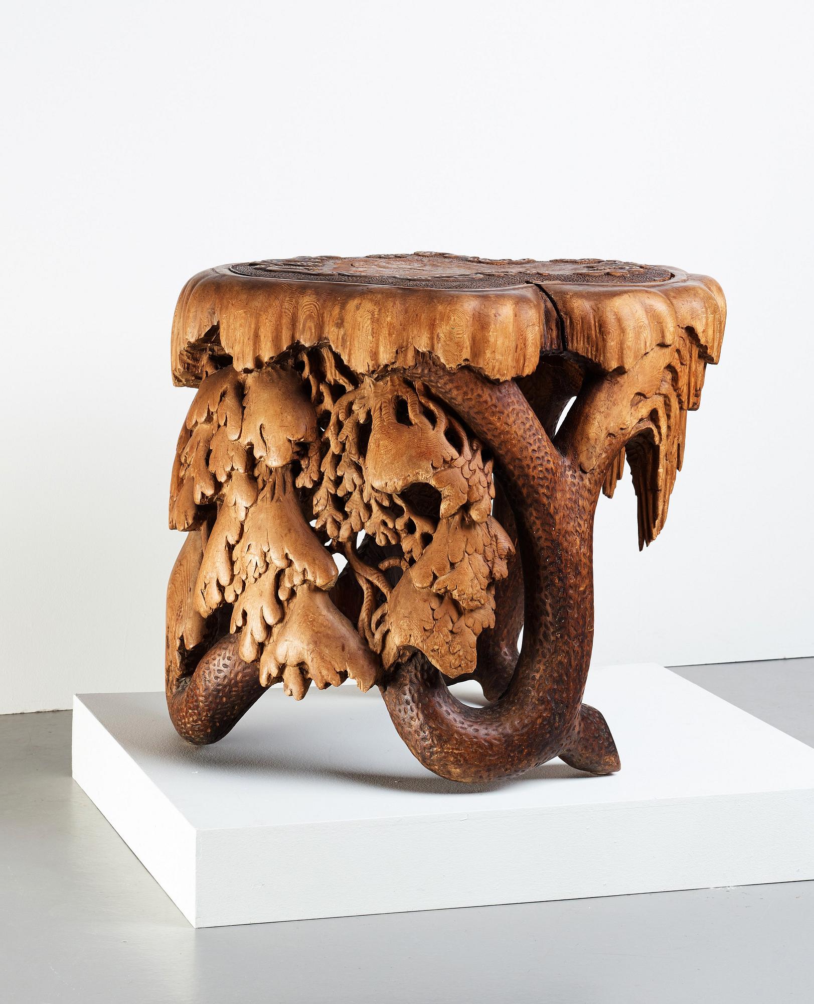 Knut Fjaestad, A Knut Fjaestad Art Nouveau sculptured pine table, Sweden ca 1900.