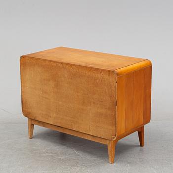 An elm wood venered chest of drawers mid 20th century.