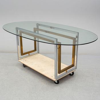 A 1980's glass top dinner table.