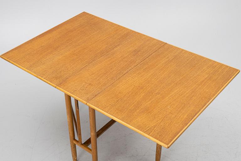 A mid20th century gate-leg table.
