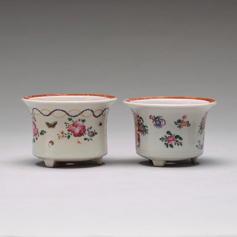 A set of four (2+2) famille rose flower pots with stands, Qing dynasty, Qianlong (1736-95).