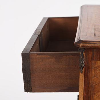 A Louis XVI-style parquetry commode, circa 1900.