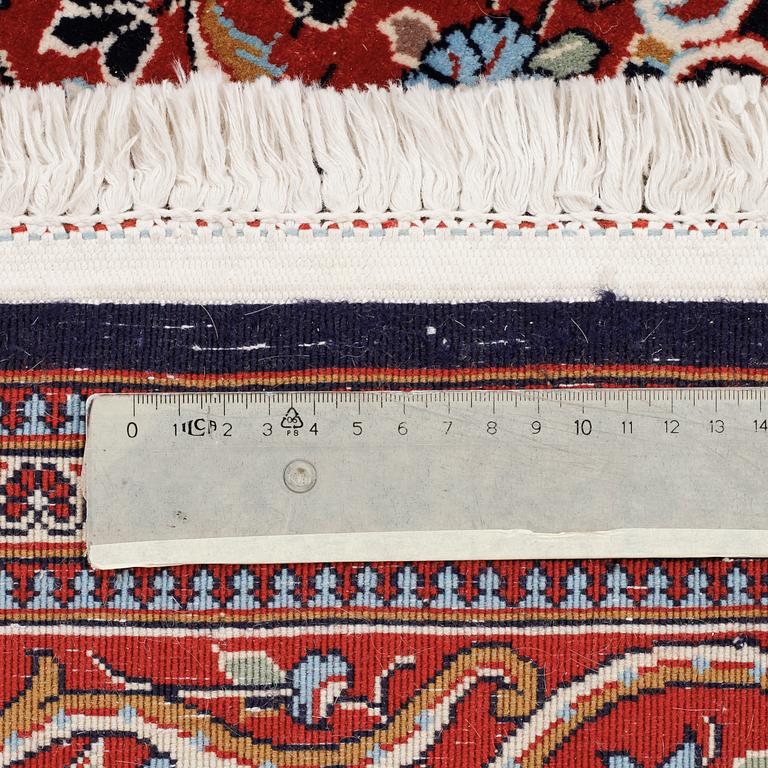 A Ghom rug, 222 x 146 cm.