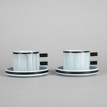 Stig Lindberg, a pair of faience tea cups with saucers, model 200, Gustavsberg studio.