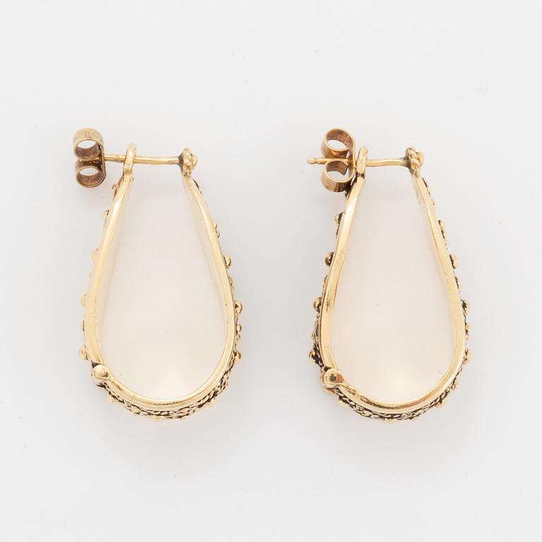 14K gold hoop earrings.