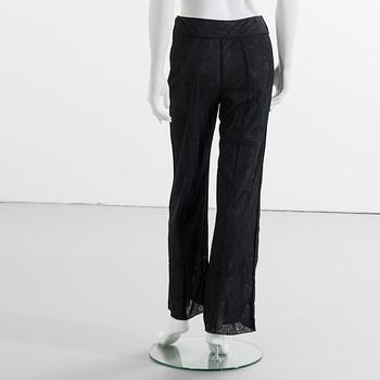 CHANEL, a black mesh evening pant.
