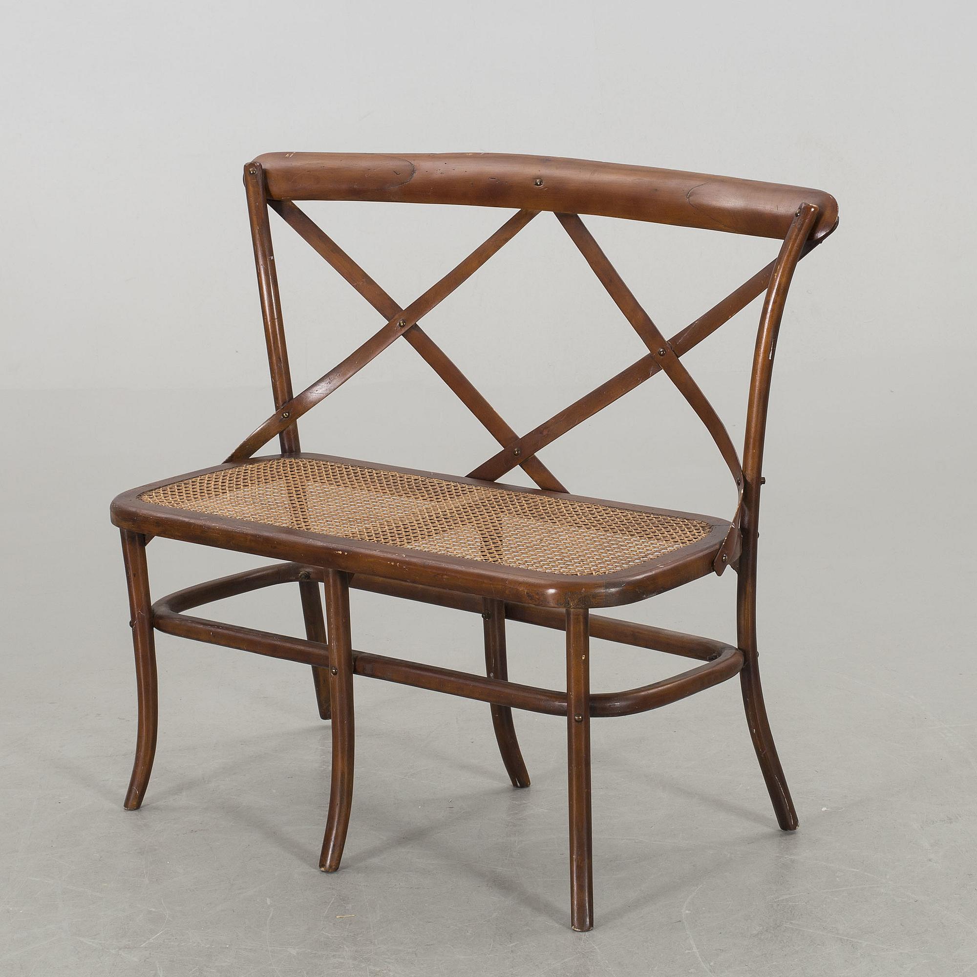 A wooden sofa, a table and four chairs, later part of the 20th century.