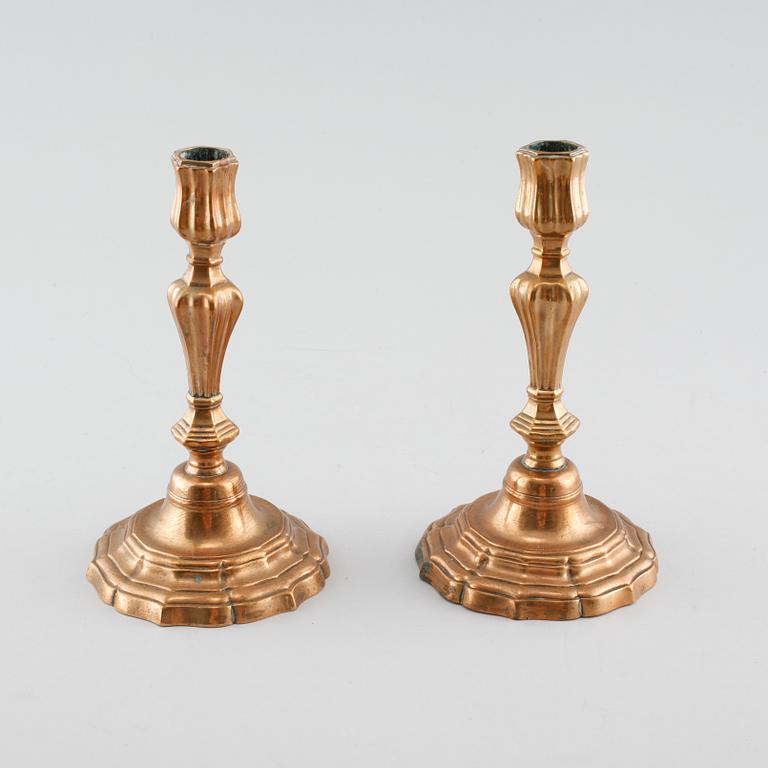 A pair of late barouqe bronze candlesticks, 18th century.