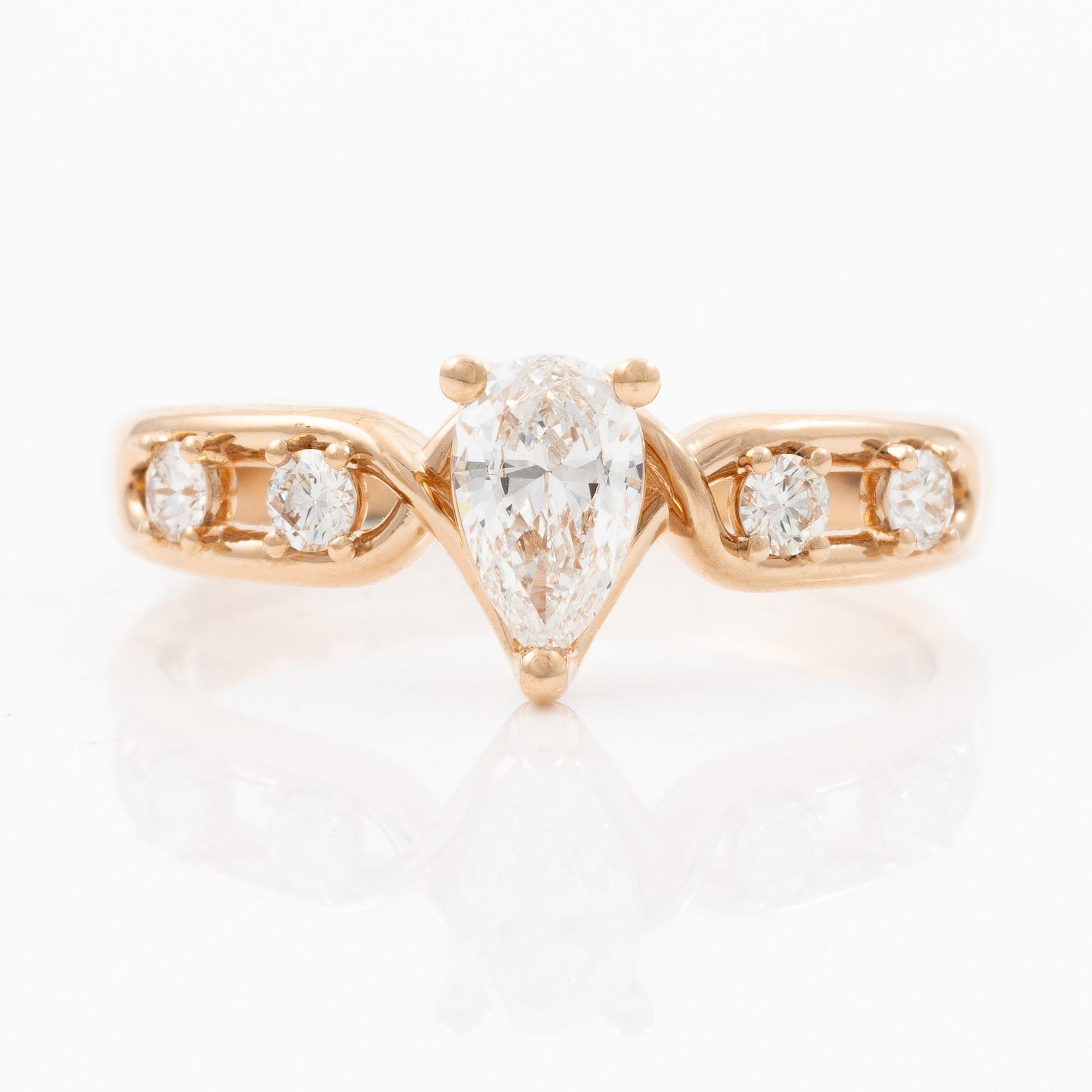 Ring 14K rose gold with a pear-shaped diamond and brilliant-cut diamonds, accompanied by an IGI report.