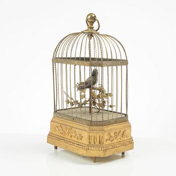 A music box in the shape of a bird's cage, France, late 19th century.