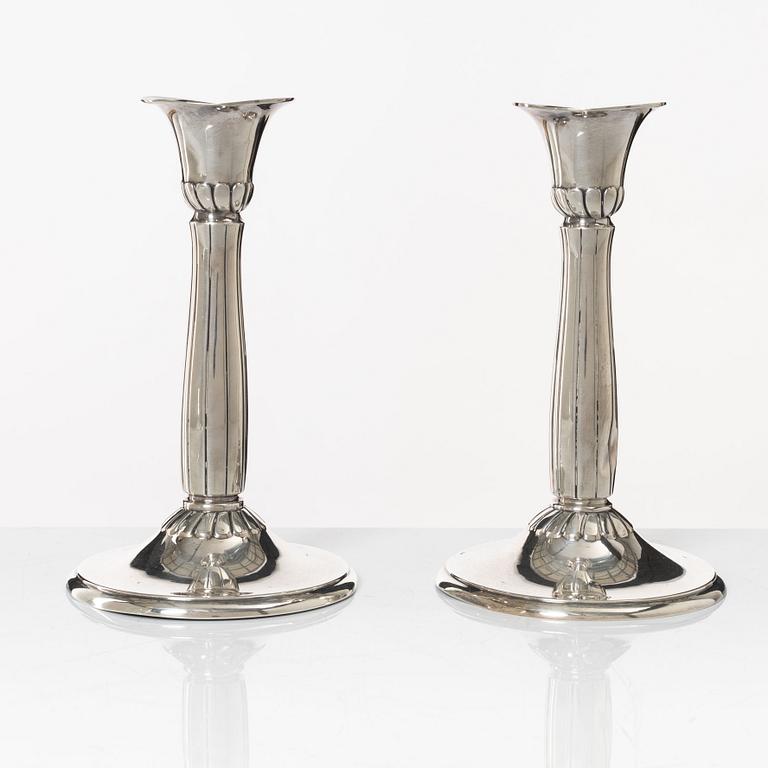 A pair of silver candle sticks, first half of the 20th century.