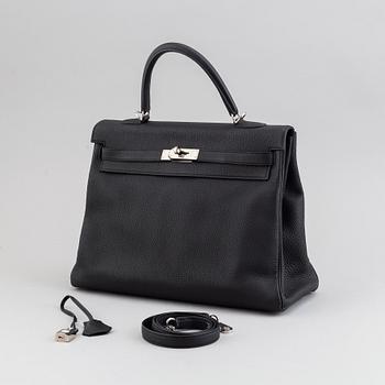 Hermès, a 'Kelly 35' black leather bag, 2017.