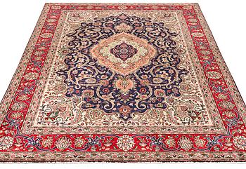 A Tabriz carpet, c. 345 x 255 cm.