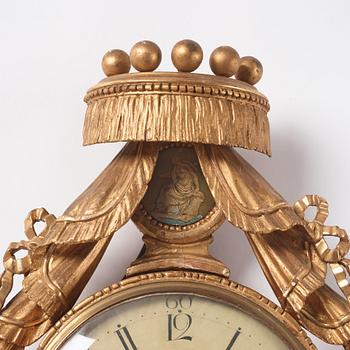 A late Gustavian giltwood cartel clock by E. Rundelius (watchmaker in Stockholm 1793-1815).