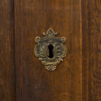 A 18th century oak rococo cabinet.