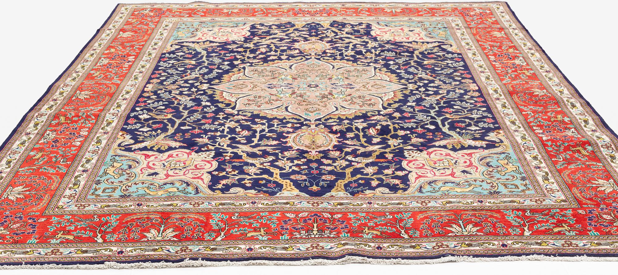 A carpet, Tabriz, signed Ipchilar, ca 385 x 280 cm.
