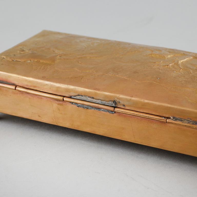 A brass coated copper cigarbox dated 1942 and signed B.S-n.