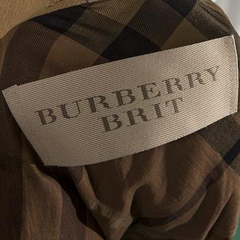 A TRENCHCOAT by BURBERRY.