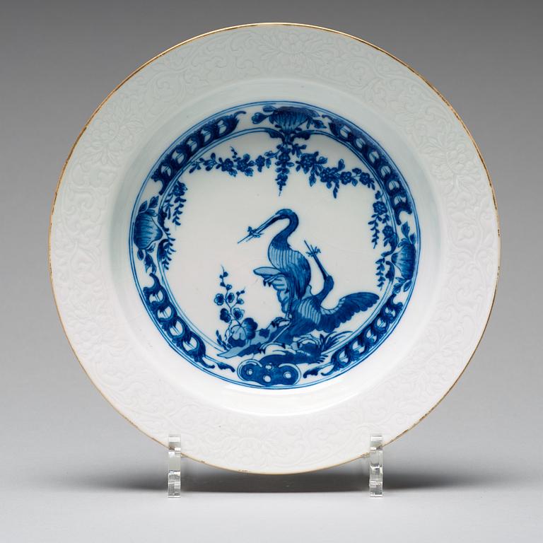 A set of eight blue and white armorial soup dishes, Qing dynasty, 18th Century.
