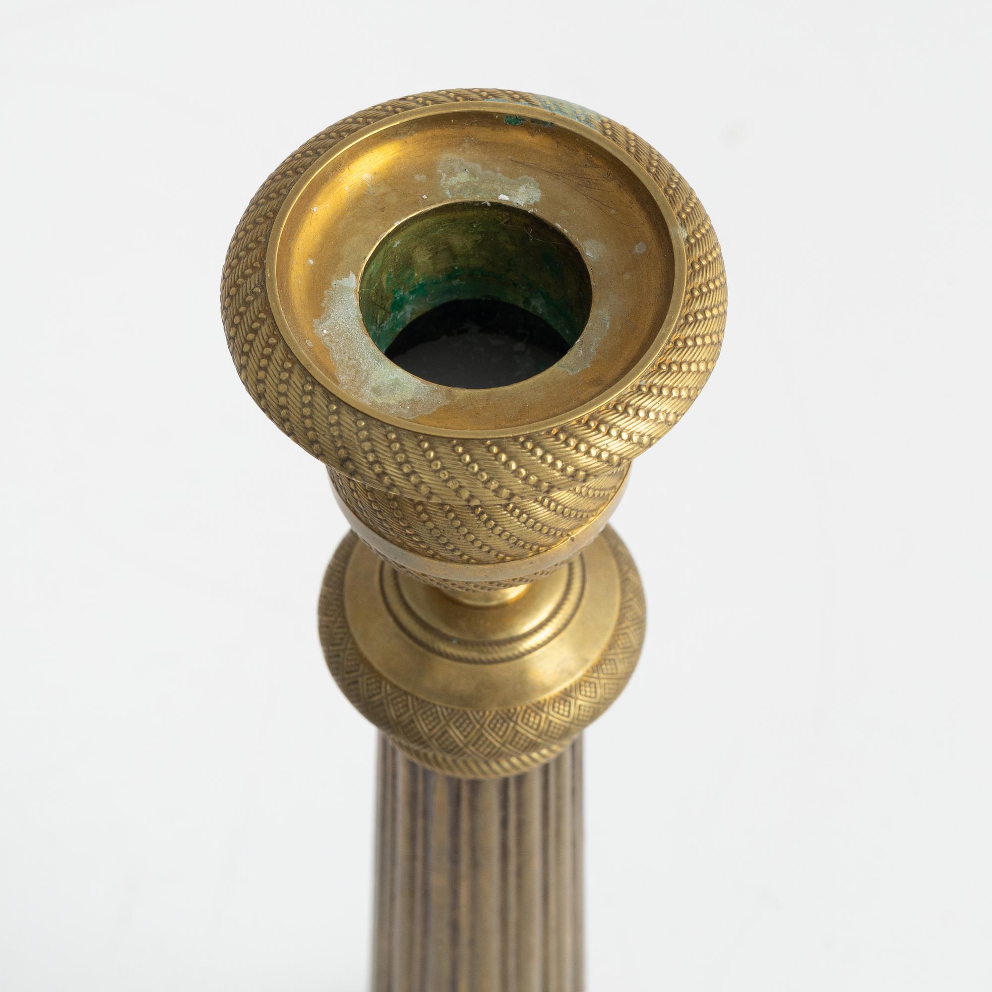 A brass Empire candlestick, first half of the 19th century,