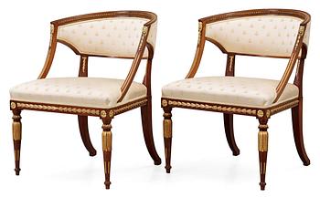 A Swedish late Gustavian-style seating circa 1900 (comprising four chairs, two armchairs, one sofa) and an Empire table.