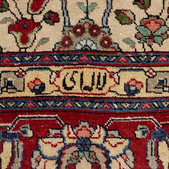 A Tabriz carpet, c. 385 x 287 cm.