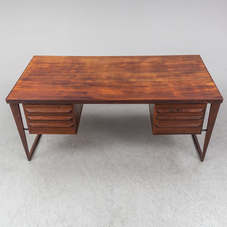 A 1960's rosewood desk by Kai Kristiansen, Feldballes Møbelfabrik, Denmark.