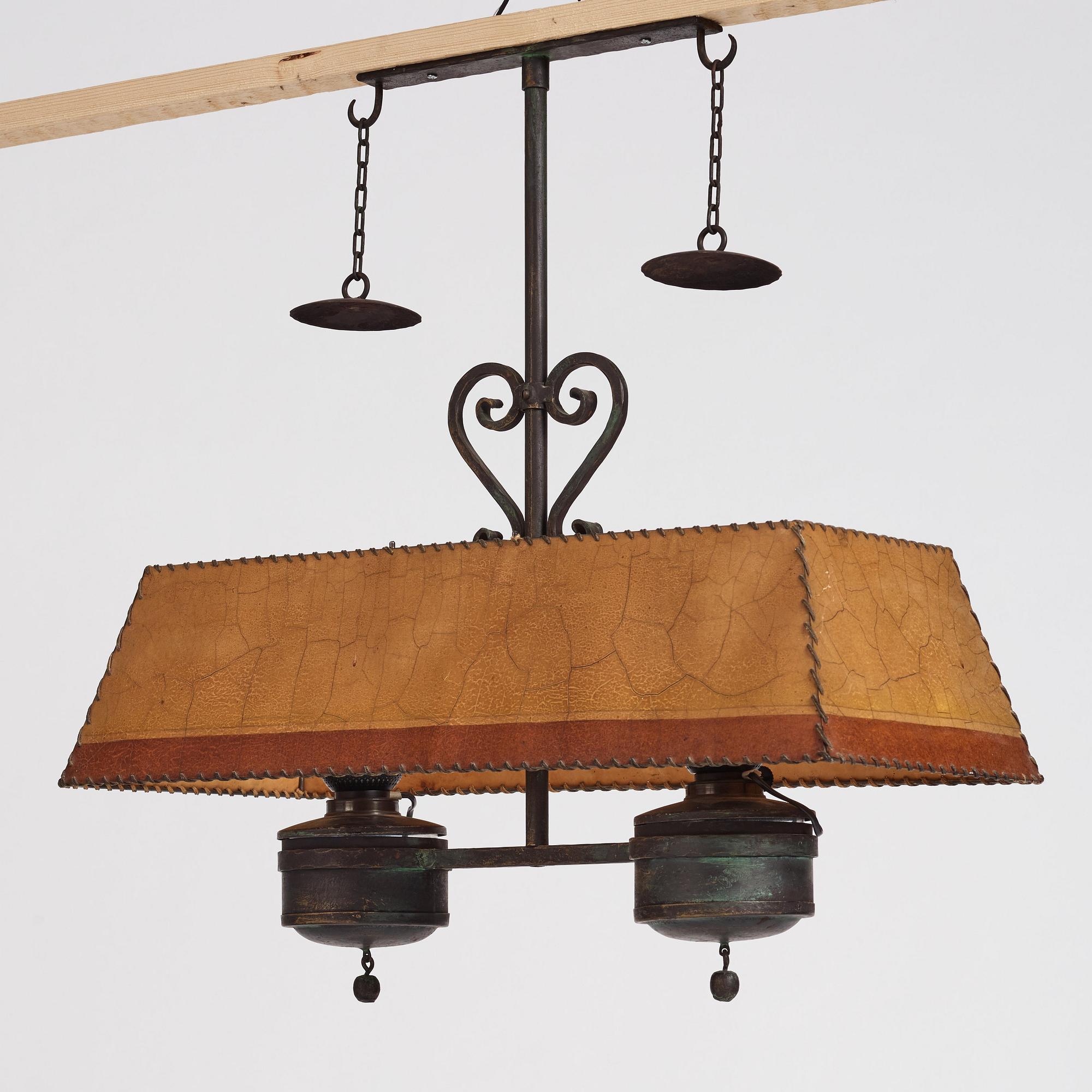 Nordiska Kompaniet, a patinated metal ceiling light for a Swedish "Sportstuge" interior, 1930's.