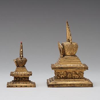 Two Tibetan gilt copper alloy stupa's, 19th Century.