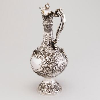 A silver wine jug, mark of J. Aldwinckle &  J. Slater, London 1881.