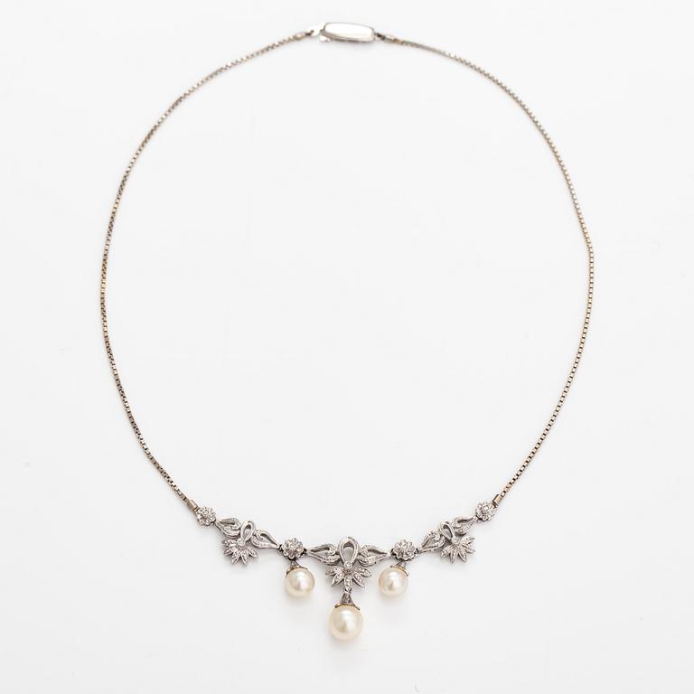 An 18K white gold necklace with cultured pearls and diamonds ca. 0.04 ct in total. Finnis import marks 1963.