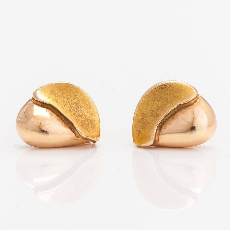 A pair of 14K gold earrings.