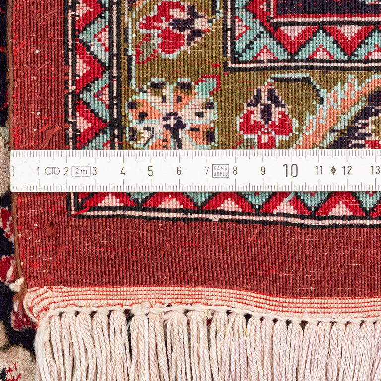 A Carpet, Silk Gohm, circa  298 x 202 cm.