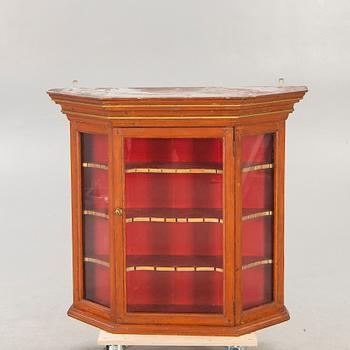 A 19th century wall cabinet.