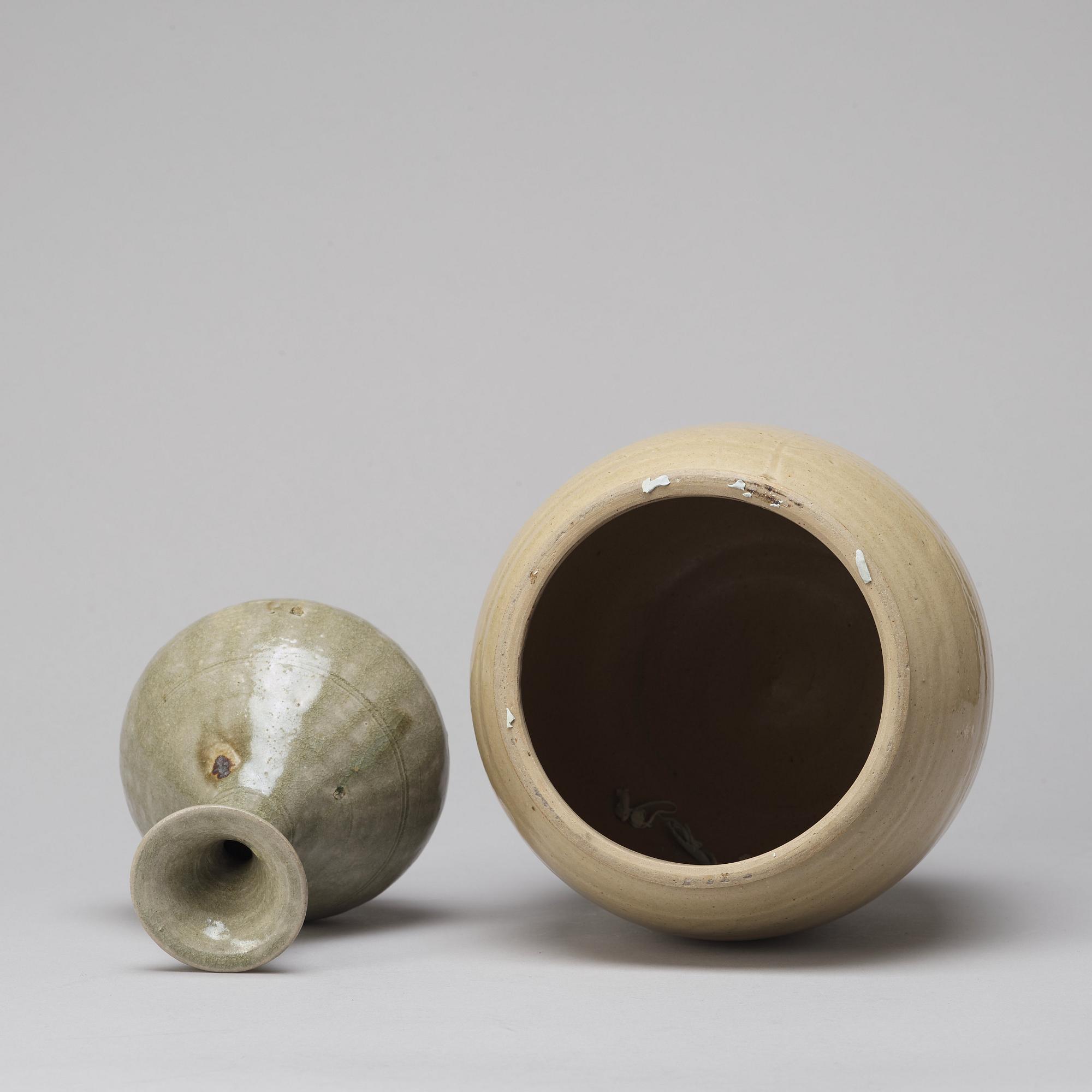 A celadon glazed jar with cover and a vase, South East Asia, 16/17th Century.