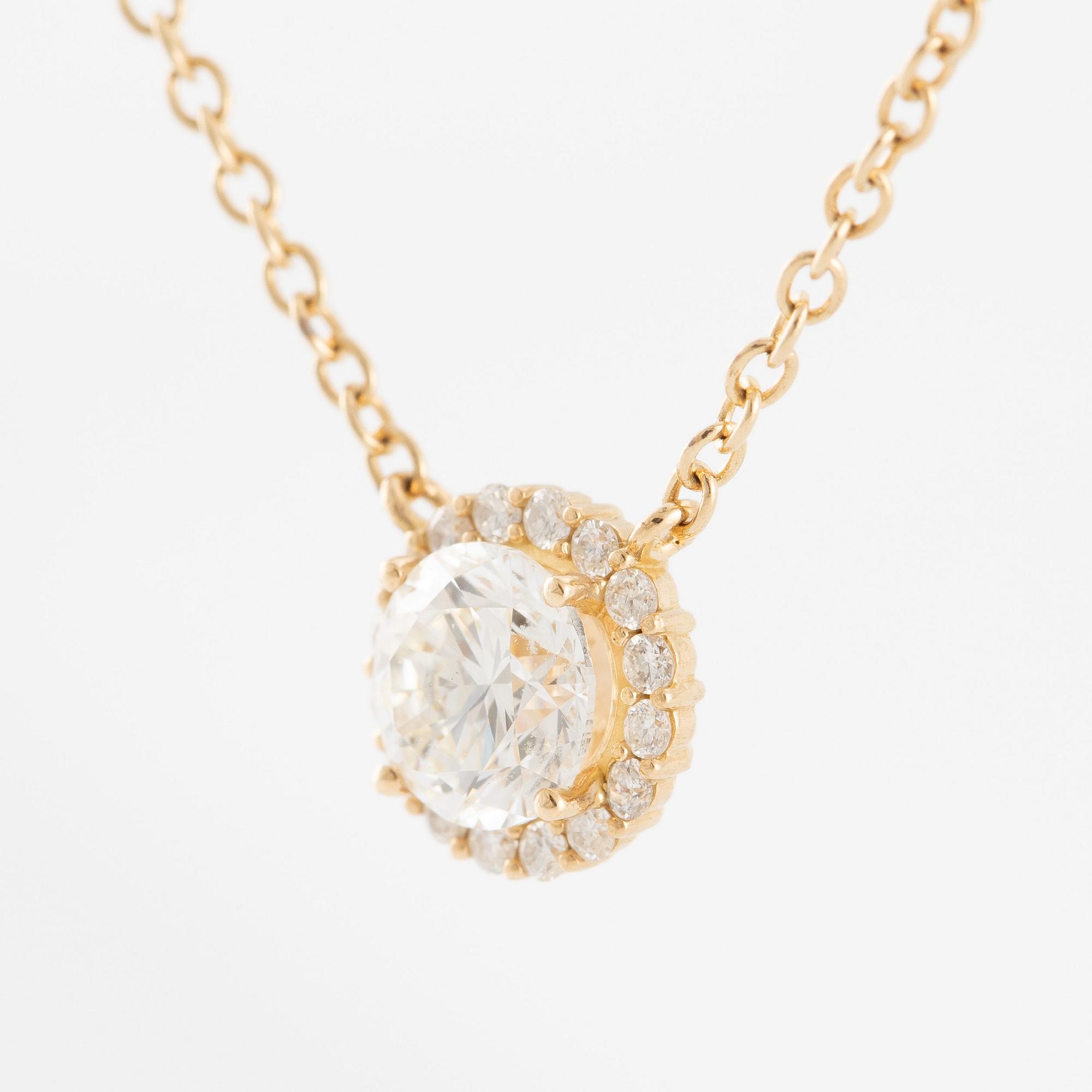 Collier 18K guld med briljantslipade diamanter.