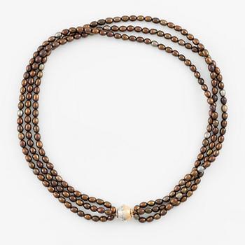 Per Borup, necklace of cultured coloured freshwater pearls, clasp 18K gold with diamonds.