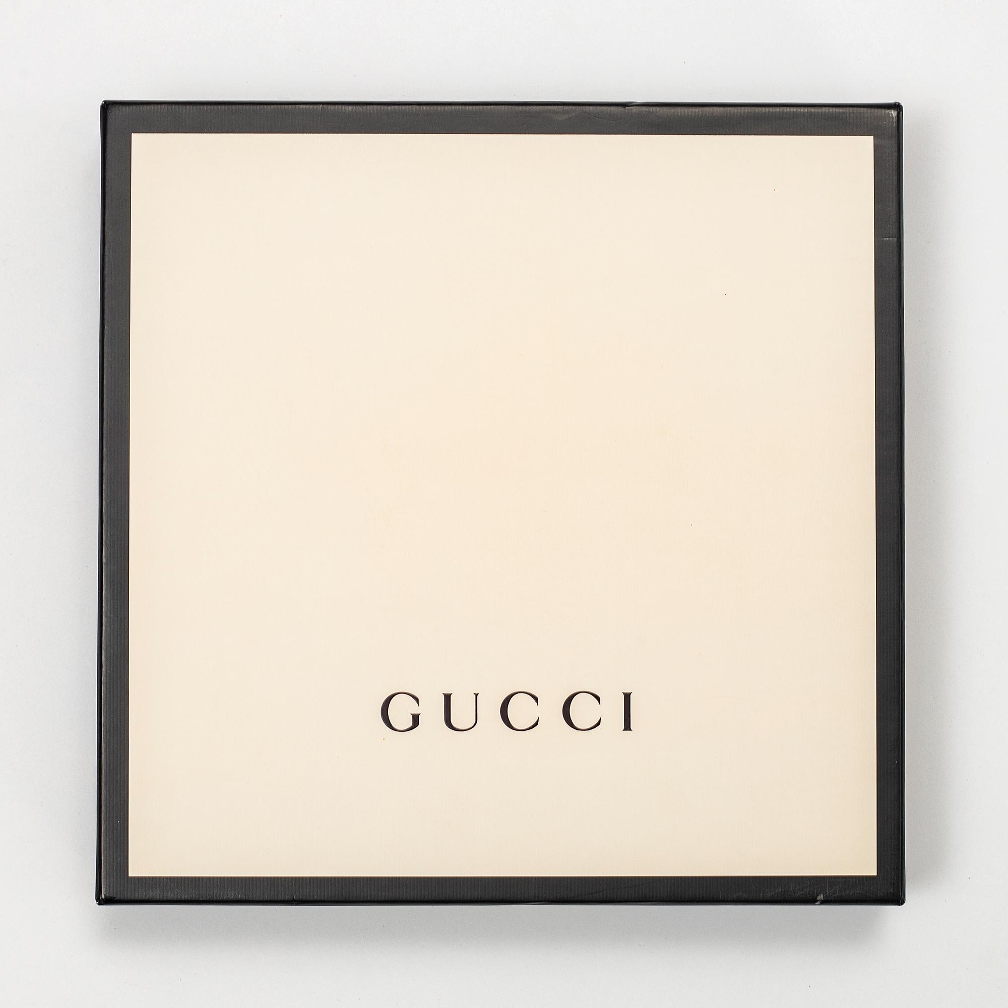 Gucci, a 'Flora' silk scarf.