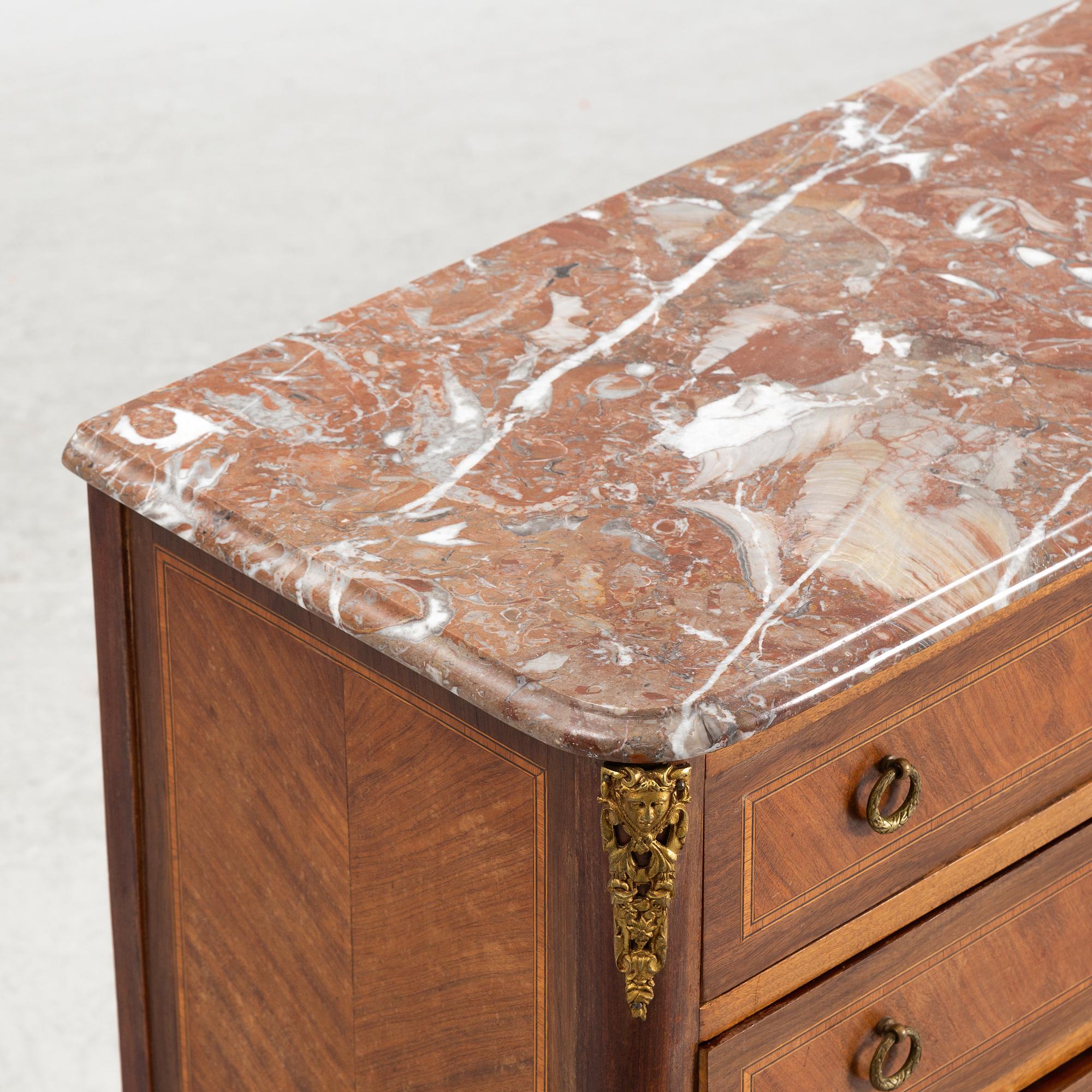 A Louis XVI style chest of drawers, mid 20th Century. - Bukowskis