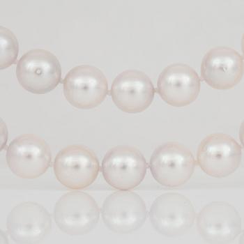 A cultured saltwater pearl necklace. Clasp set with brilliant-cut diamonds.