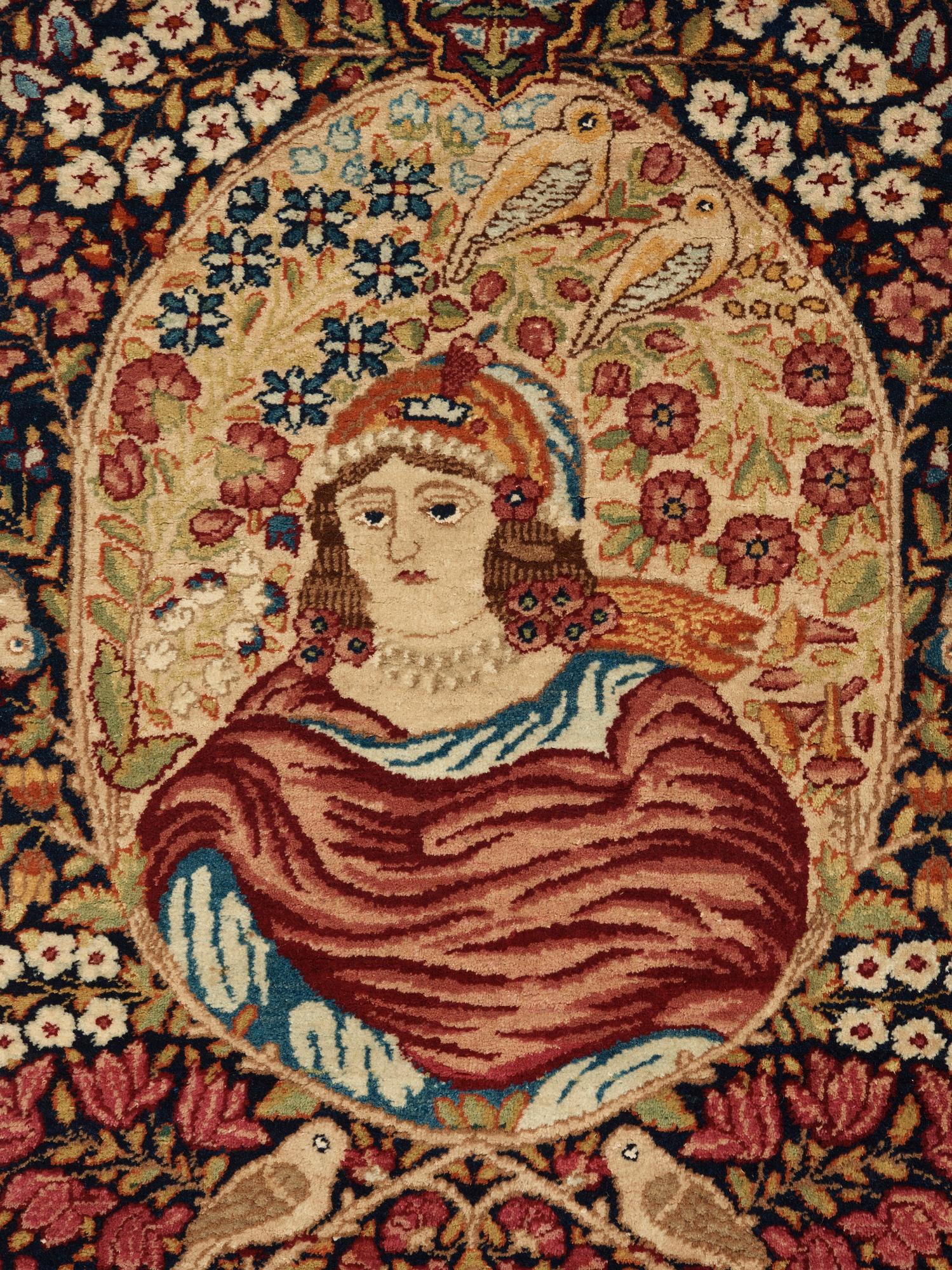 A RUG. A semi-antique Kerman Laver figural. 79,5 x 64,5 cm.